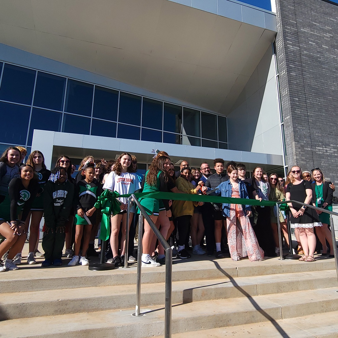 Students, teachers, administrators and others cut the ribbon to the new Jarrett Middle School.