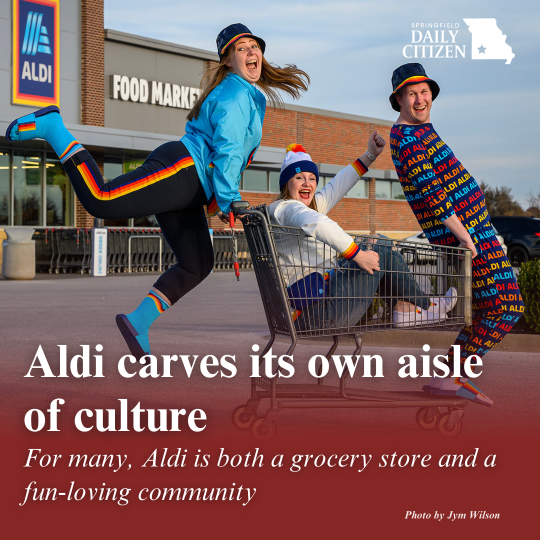 Aldi supermarket super-fans Allyson Dougherty, 27, left, Melany Myers, 28, and Michael Underlin, 42, all of Springfield, express their enthusiasm for the Aldi food market chain. Text on the image reads: "Aldi carves its own aisle of culture. For many, Aldi is both a grocery store and a fun-loving community."