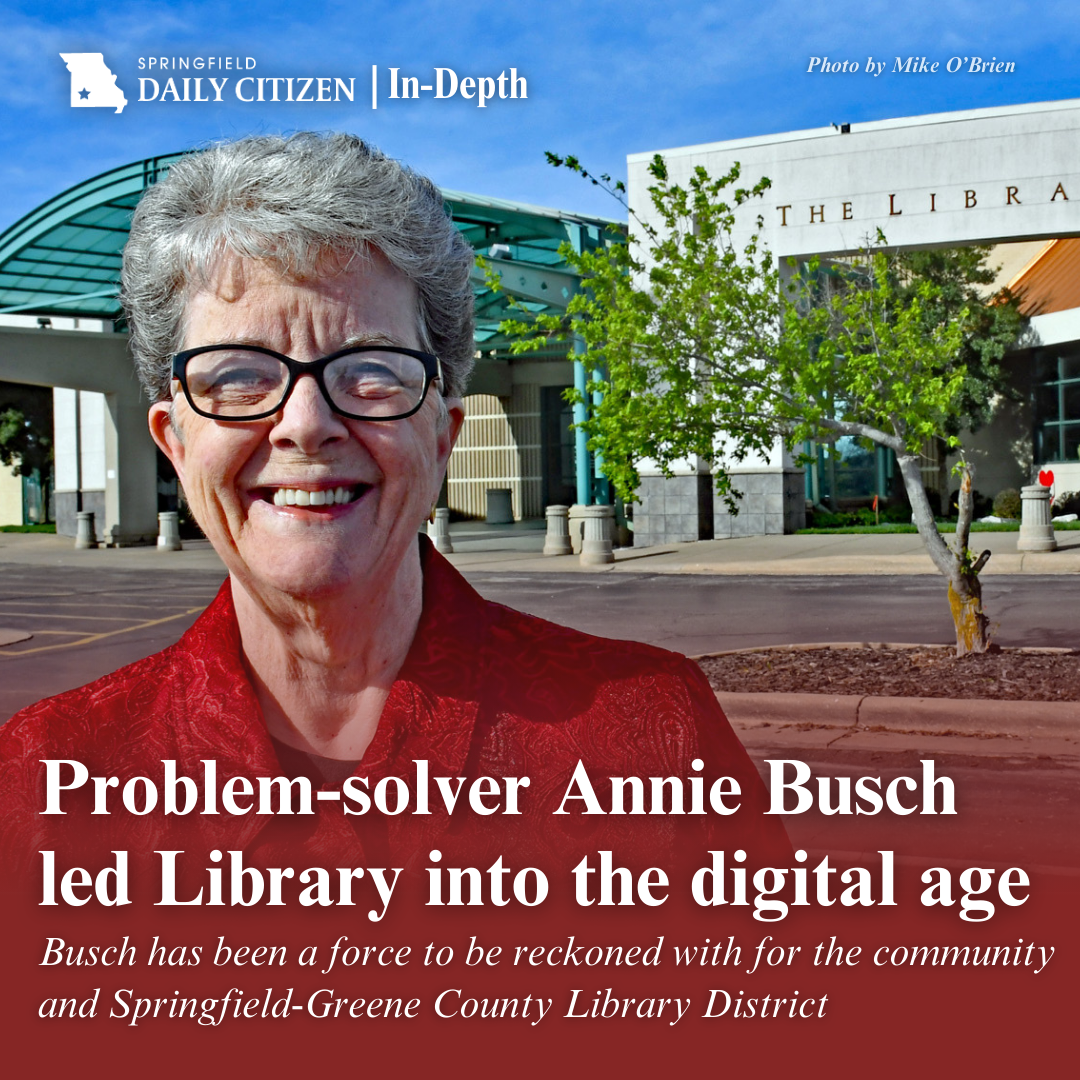 Annie Busch beams in front of one of her chief accomplishments when she was director of the Springfield-Greene County Library District — The Library Center, the district’s main branch library and home of its administrative offices, at 4653 S. Campbell Ave. Text on the image reads, "Problem-solver Annie Busch led Library into the digital age. Busch has been a force to be reckoned with for the community and Springfield-Greene County Library District." (Photo by Mike O’Brien)