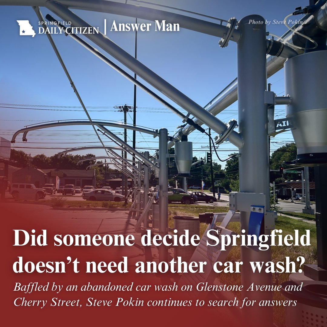 New car wash equipment gleams in the hot sun. Unused. Text on the image reads: "Did someone decide Springfield doesn;t need another car wash? Baffled by an abandoned car wash on Glenstone Avenue and Cherry Street, Steve Pokin continues to search for answers." (Photo by Steve Pokin)