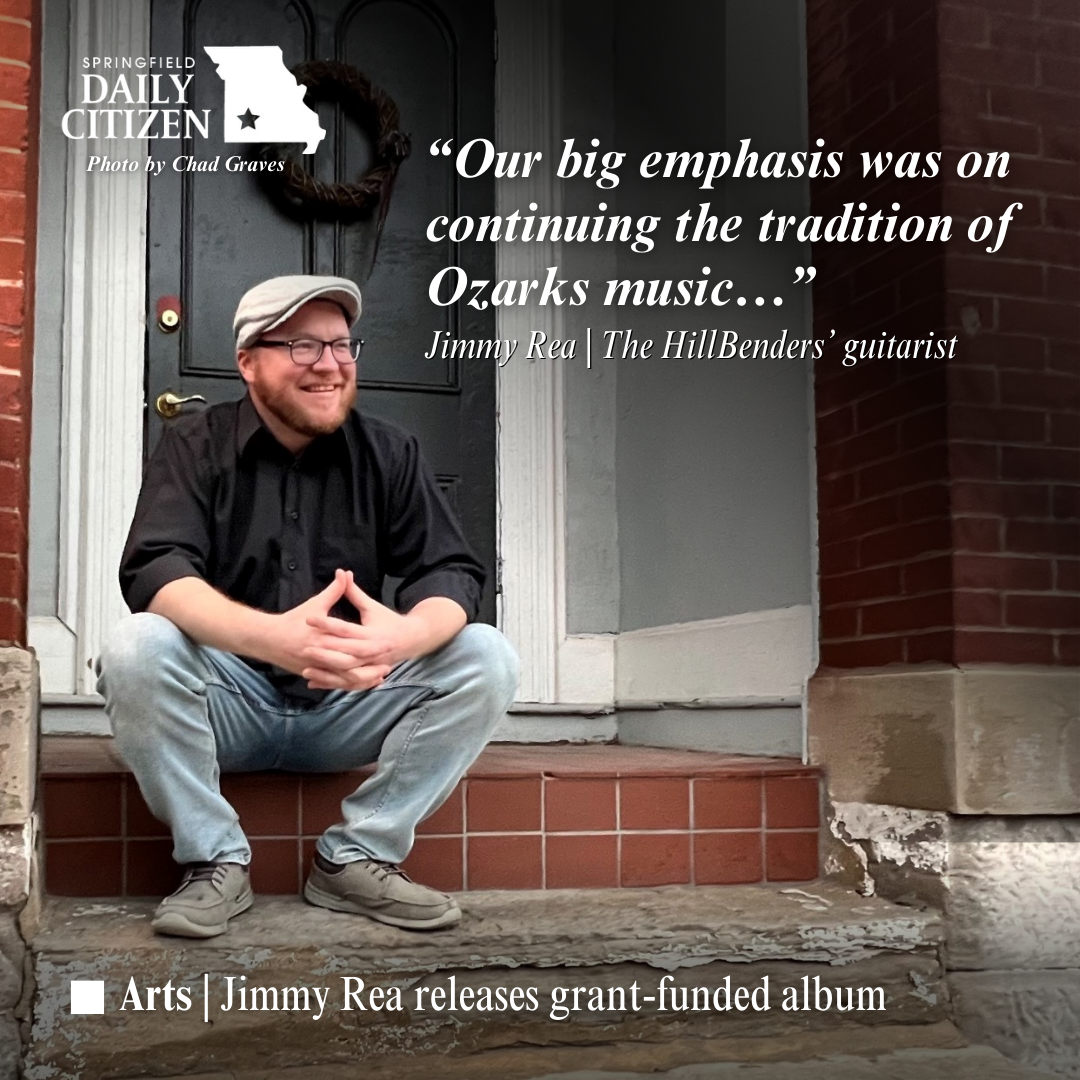 Musician Jimmy Rea, wearing a black button-down shirt and a gray hit, sits on the stoop outside a brick building. Text on the image reads: "Our big emphasis was on continuing the tradition of Ozarks music..." Jimmy Rea | The HillBenders' guitarist (Photo by Chad Graves)