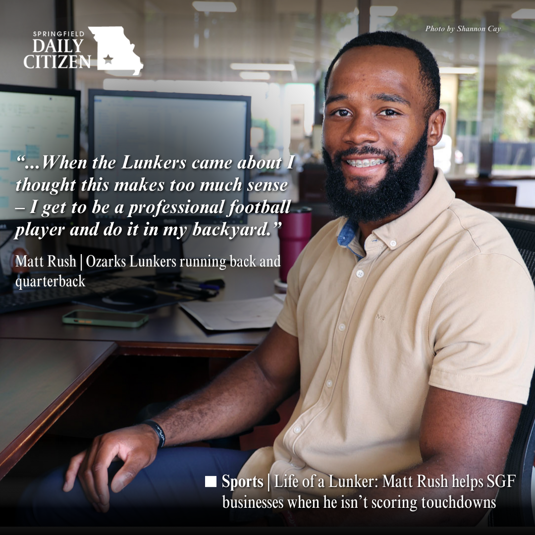 Matt Rush, football player for the Ozarks Lunkers, sits at his desk at Central Bank. Text on the image reads: "...When the Lunkers came about I thought this made too much sense — I get to be a professional football player and do it in my backyard." Matt Rush | Ozarks Lunkers running back and quarterback (Photo by Shannon Cay) 