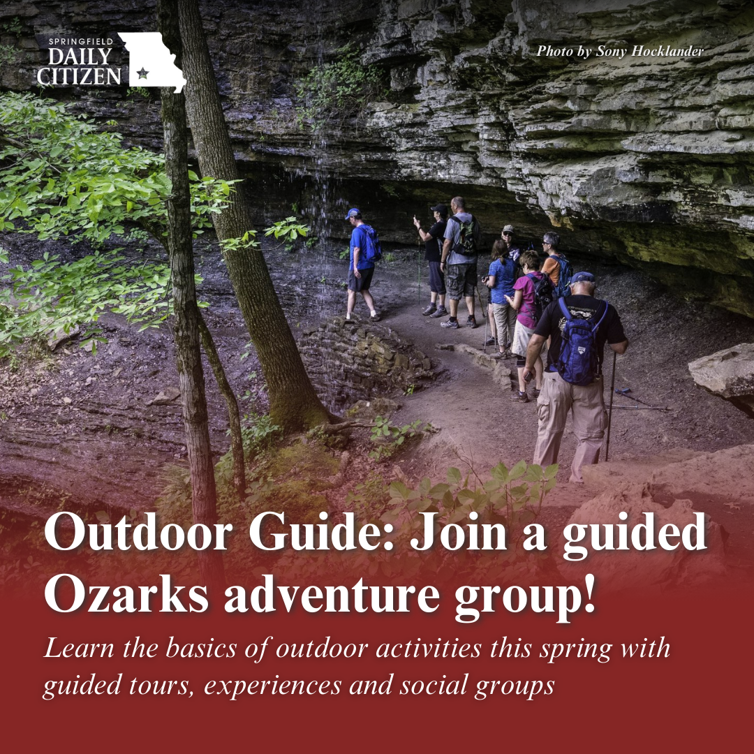 Hikers walk behind a waterfall on a trail at Devil’s Den State Park. Text on the image reads, "Outdoor Guide: Join a guided Ozarks adventure group! Learn the basics of outdoors activities this spring with guided tours, experiences and social groups. (Photo by Sony Hocklander)