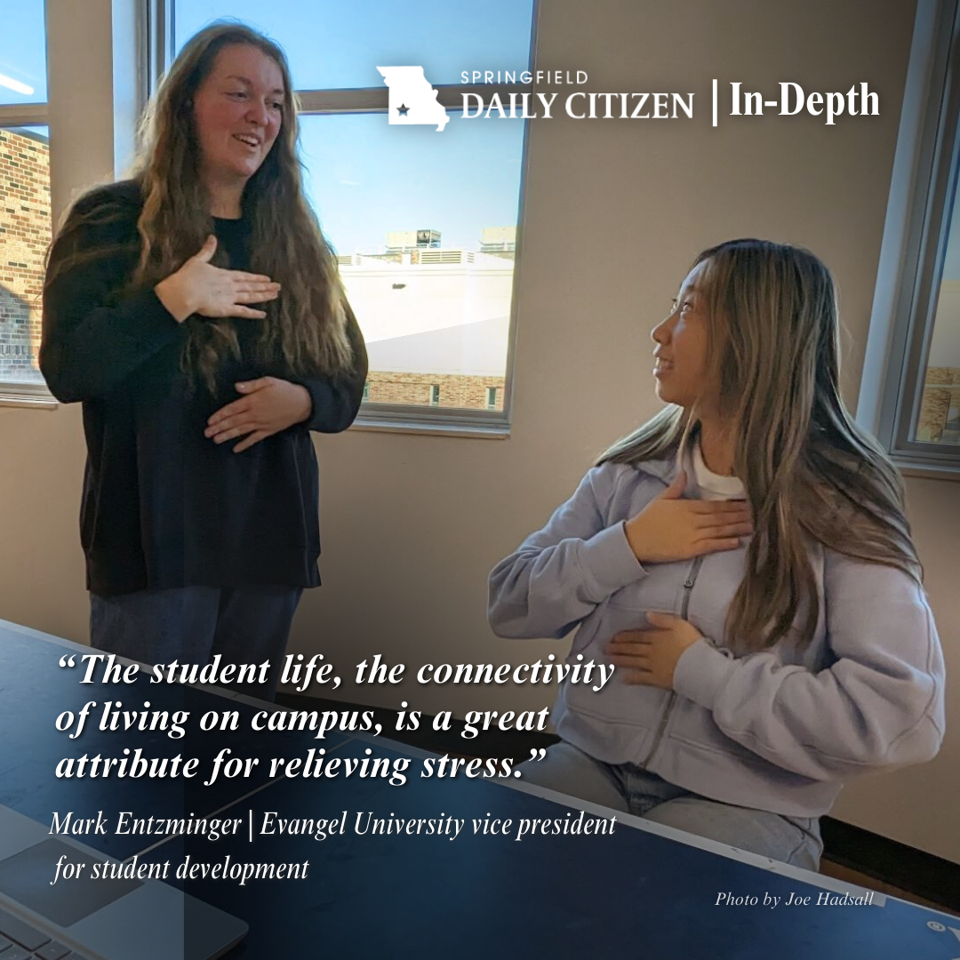 Two Evangel University students study for a final in December 2023. The two students live in the newly renovated Grace Walther Hall. Text on the image reads: "The student life, the connectivity of living on campus, is a great attribute for relieving stress." Mark Entzminger | Evangel University vice president for student development (Photo by Joe Hadsall)