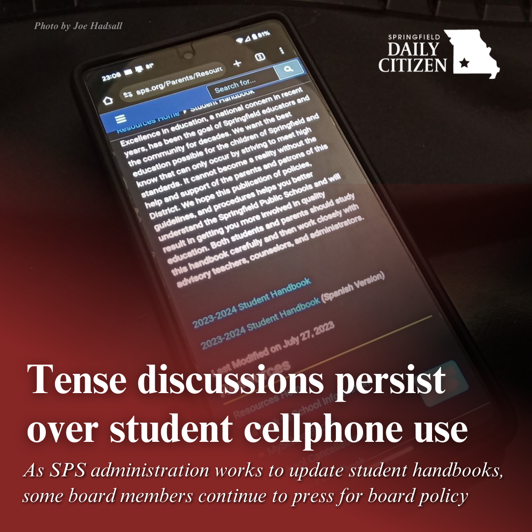 A cellphone is ready to download SPS' student handbook for the previous school year. Text on the image reads: "Tense discussions persist over student cellphone use. As SPS administration works to update student handbooks, some board members continue to press for board policy." (Photo by Joe Hadsall)