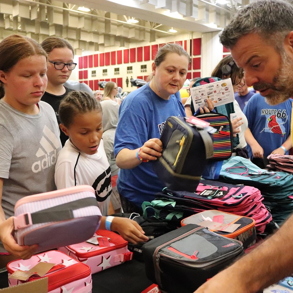 Families pick up backpacks during last year's Back to School Bash.