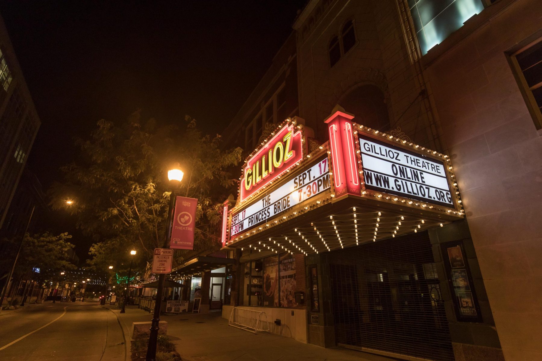 The Historic Gillioz theater lit up at night. The sign indicates that they are showing the princess bride.