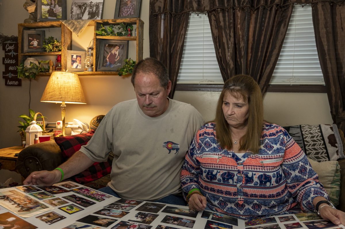 Kevin and Carol Winslow look at photographs of their son Sean that were displayed at his funeral. Sean died in Feb., 2022 at age 27 after falling and hitting his head after being tased by Greene County deputy sheriffs in Springfield, MO, on January 28, 2022.