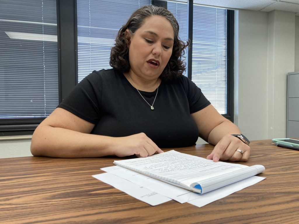 This is a photo of Lisa Crawford, Circuit Manager for the Greene County Children’s Division Office, reading a list of things her workers want people to know about kids in foster care.