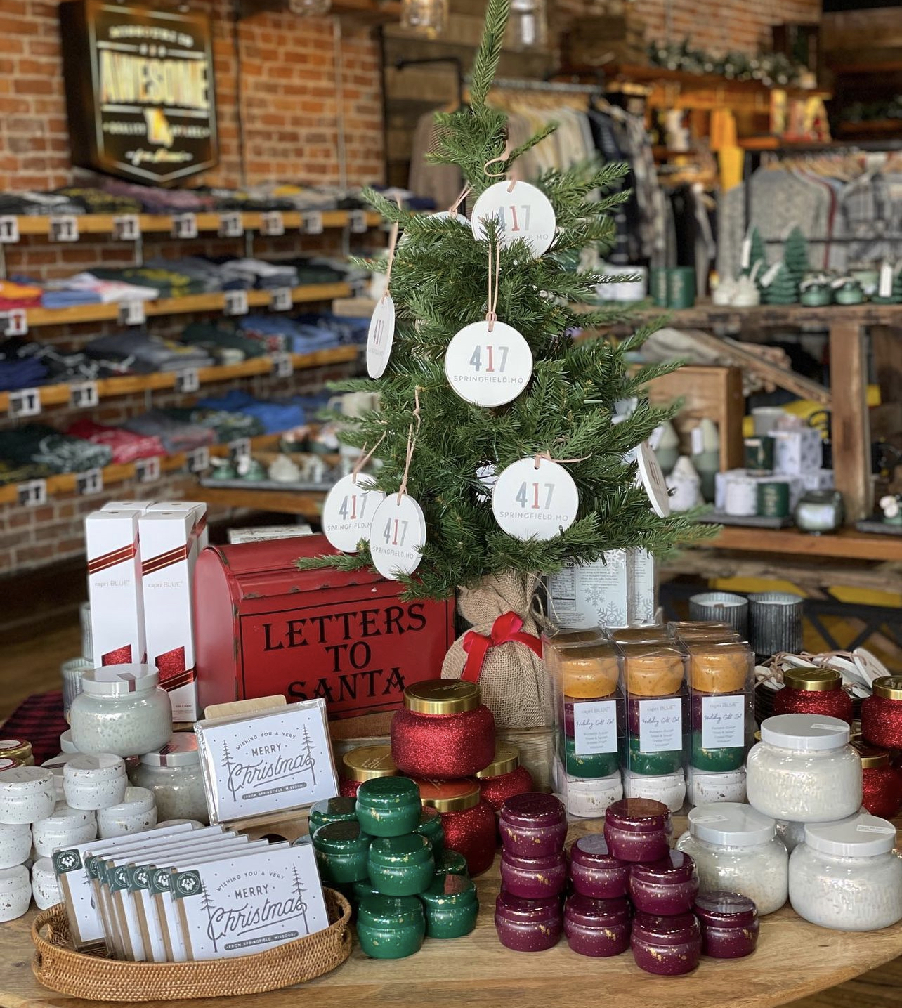 A display of Christmas ornaments and gifts inside 5 Pound Apparel in Springfield, Missouri