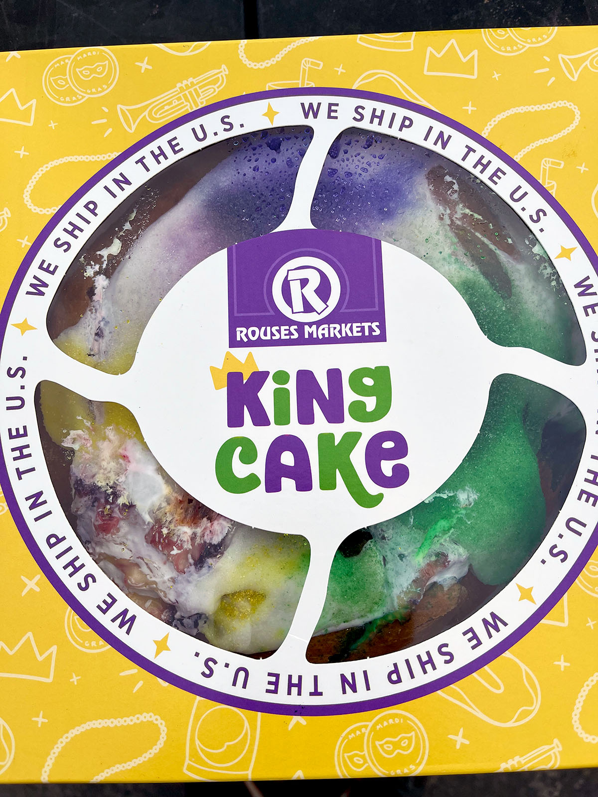 A boxed King Cake from Rouses Markets