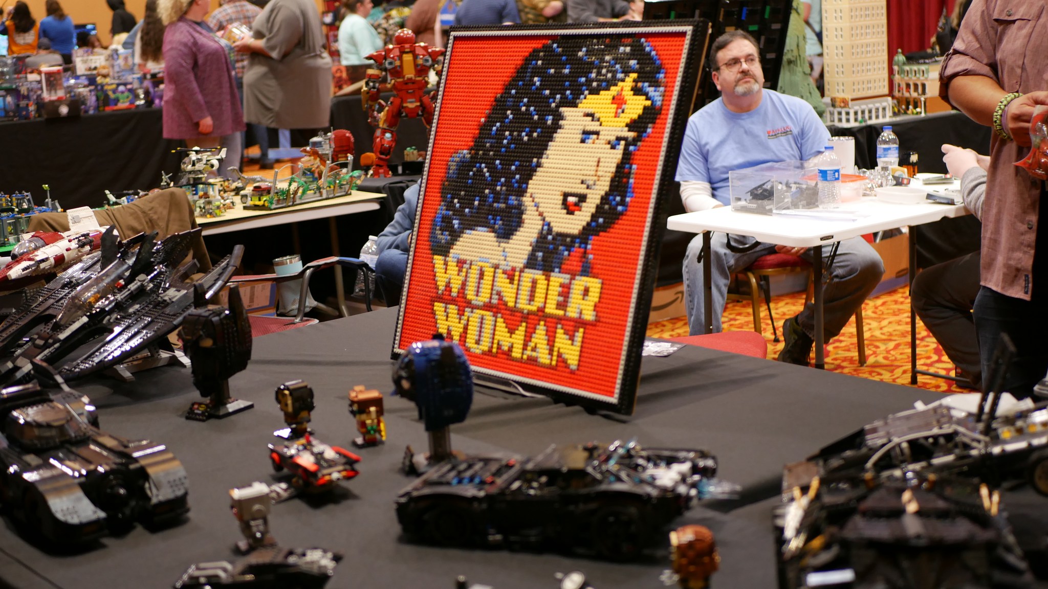 A table of Lego displays at a comic con