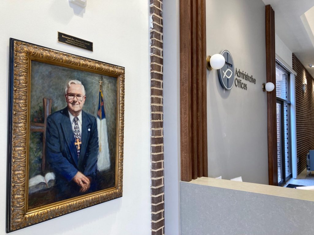 A painting of Council of Churches of the Ozarks founder the late Rev. Dorsey Levell hangs in the new headquarters building