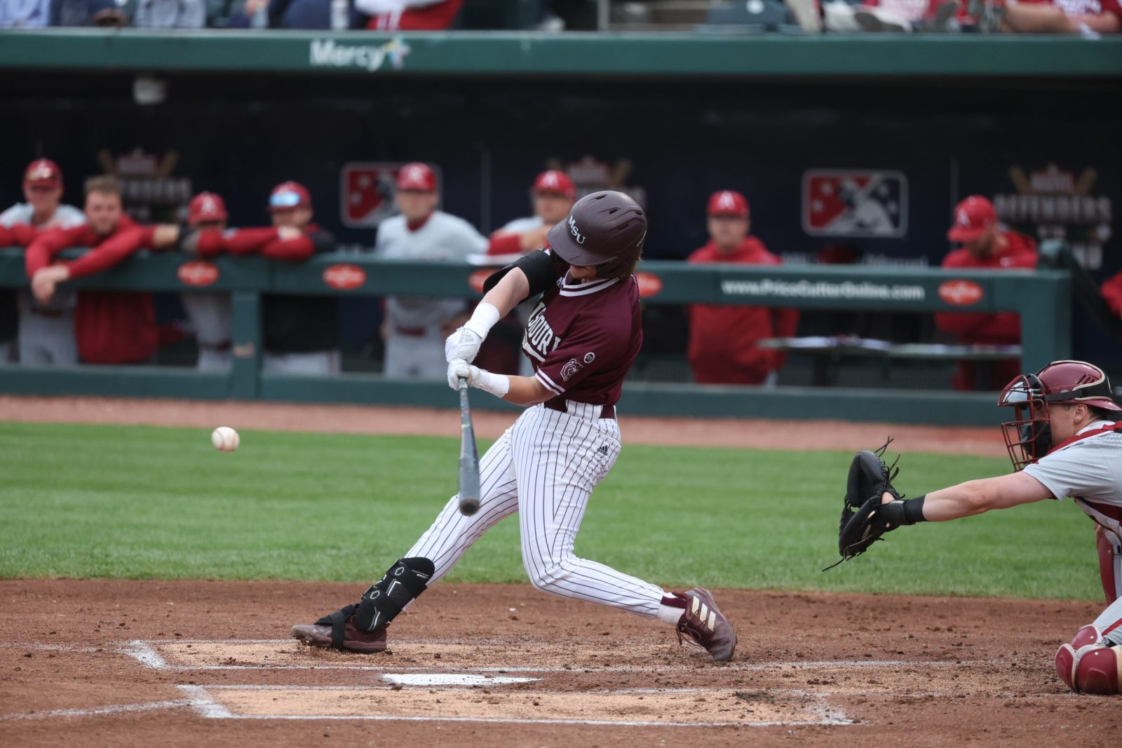 A baseball player hits a home run