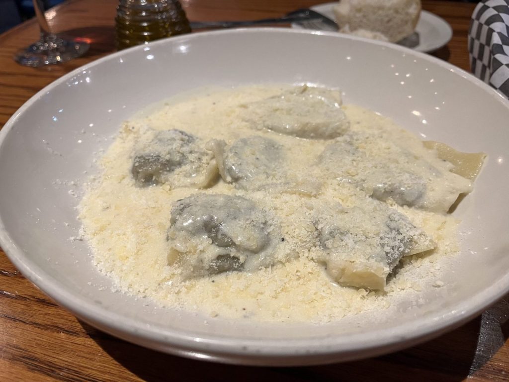 A dish of ravioli sits on a table