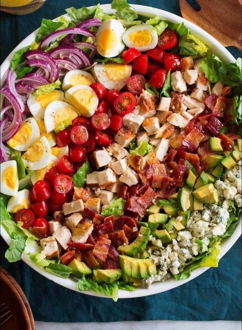A salad in a green bowl
