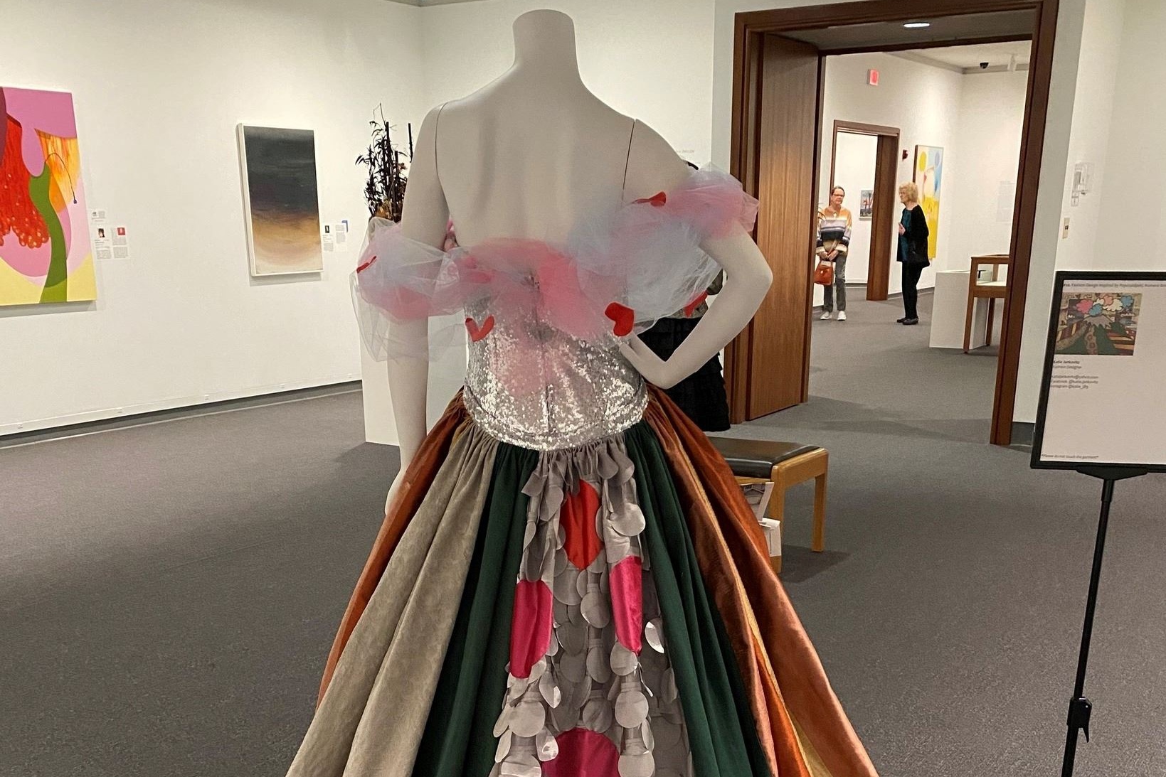 A dress is displayed on a mannequin inside an art museum