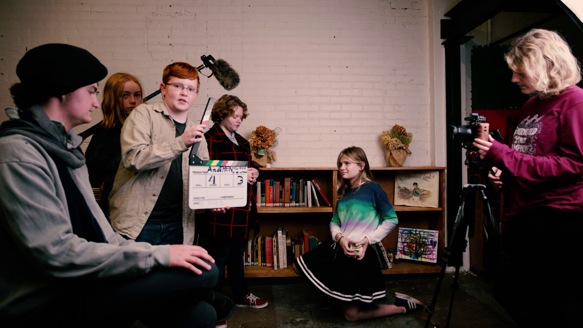 A group of children prepares to record a scene from a movie
