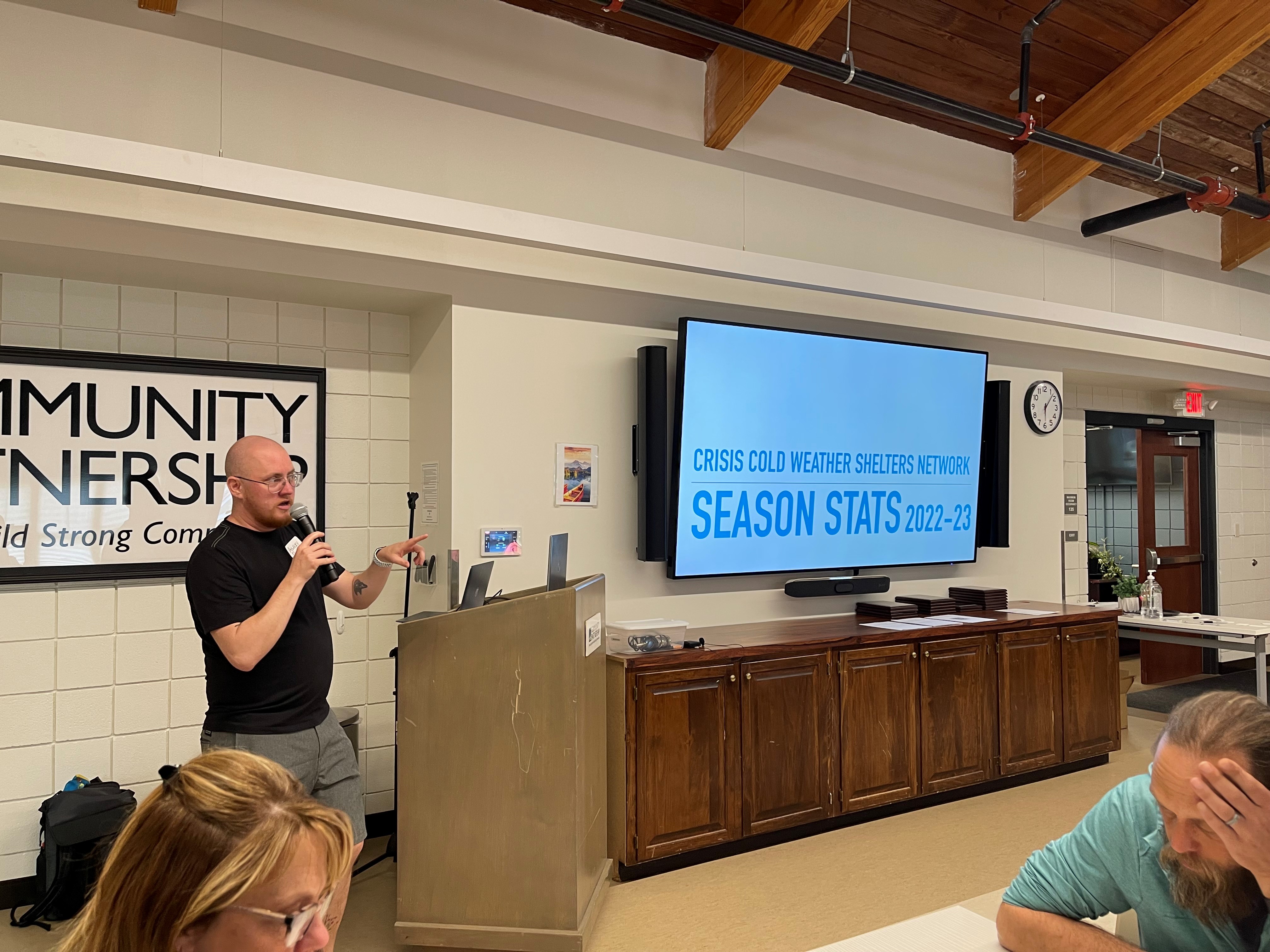 Ashley Quinn, chair of the Crisis Cold Weather Shelter Planning Committee and Shelter Coordinator, shares stats about the shelter program at a recent appreciation dinner.