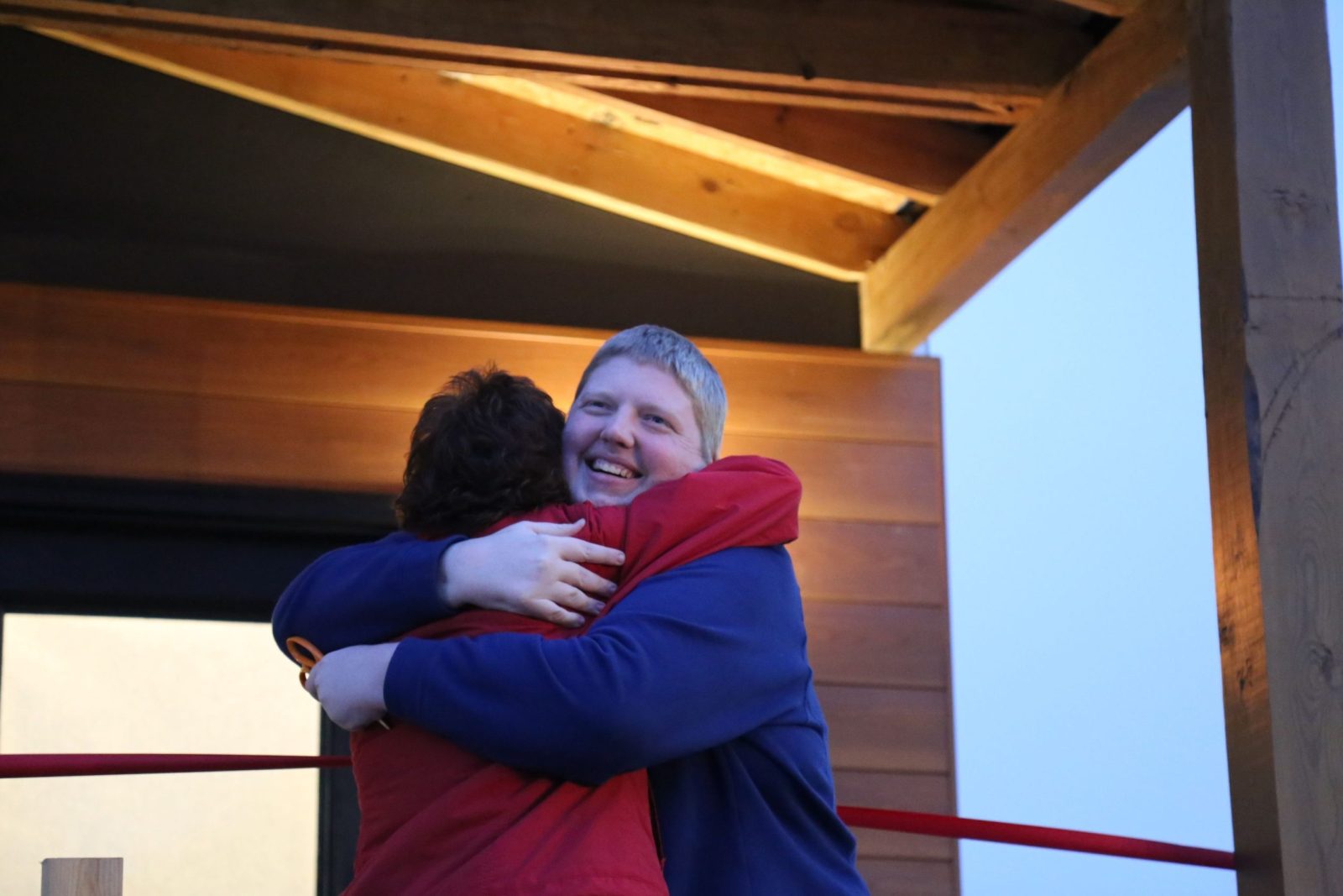 In this 2018 photo, Mel Woods (right) hugs Traci Sooter, the director of Drury’s Design-Build program, on the front porch of the home Sooter's students designed and built for Woods.