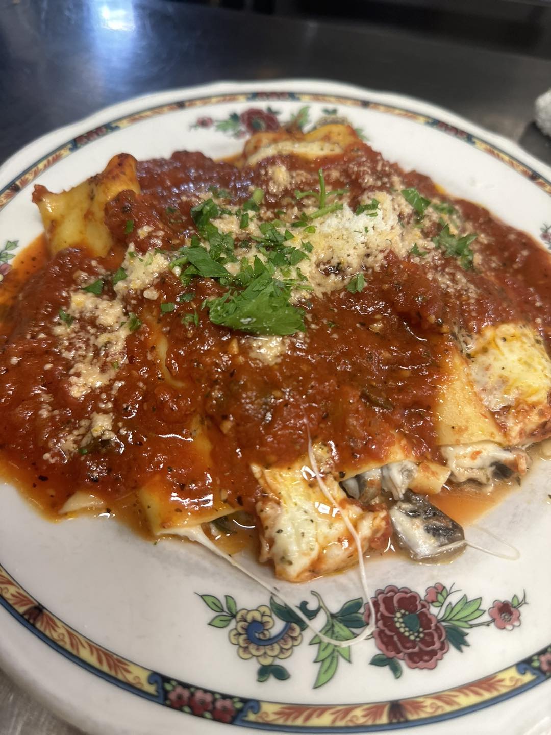 A plate of pasta with red sauce