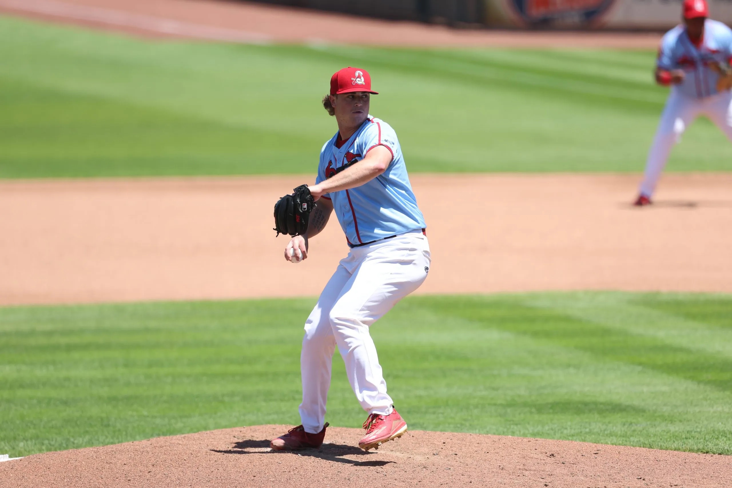 Gordon Graceffo, wearing a Springfield Cardinals uniform, pitches the baseball