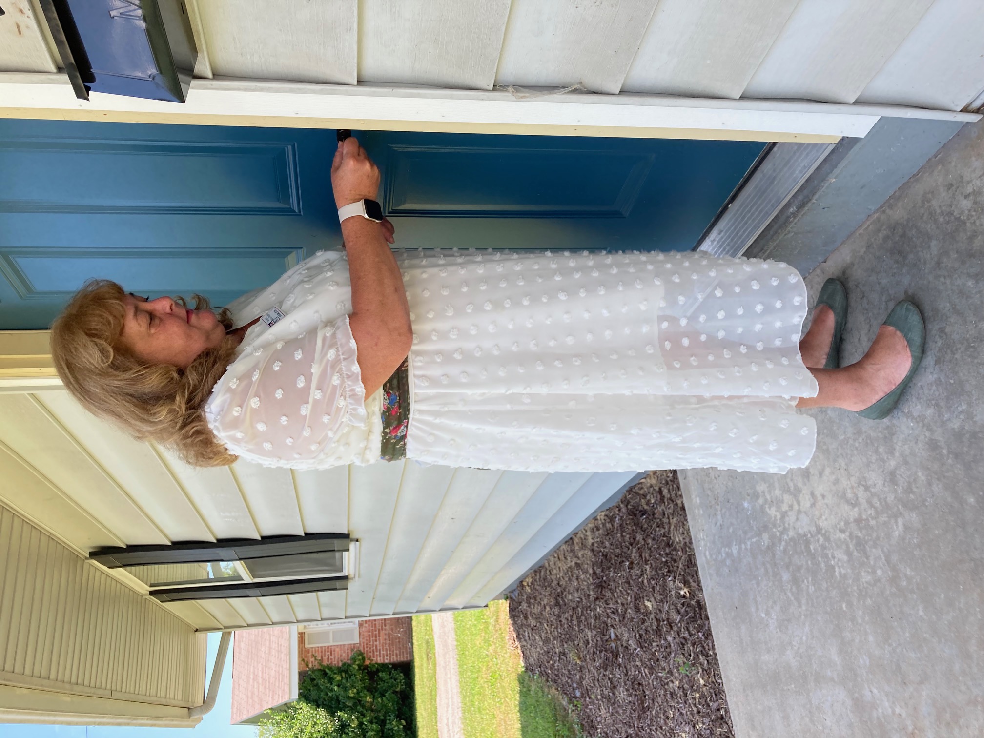 Abigail Cool, executive director of the Women's Medical Respite, unlocks the front door of the program's new home.