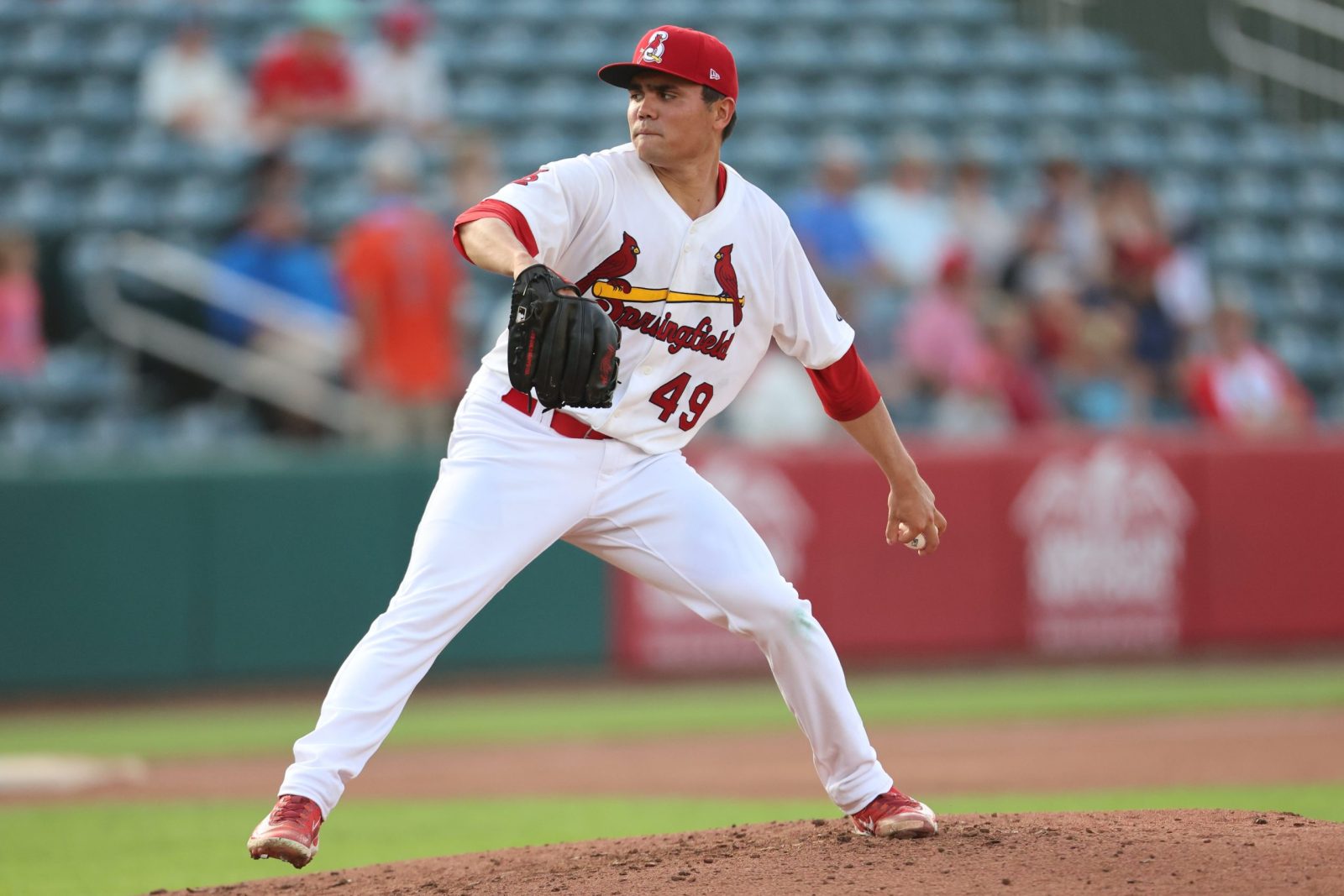 Alex Cornwell, wearing a Springfield Cardinals uniform, pitches the baseball during a game
