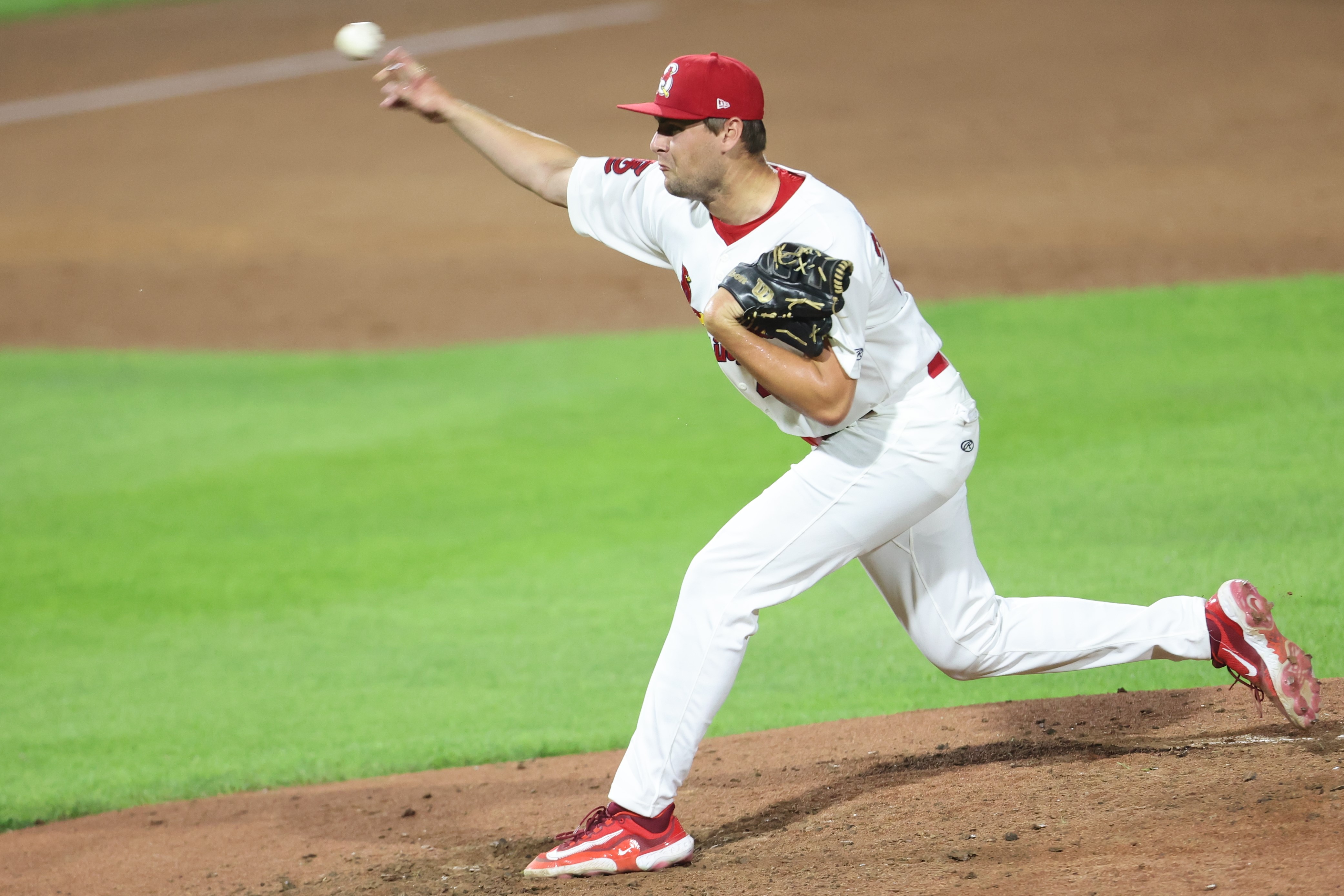 Matt Svanson, wearing a Springfield Cardinals uniform, pitches the baseball during a game