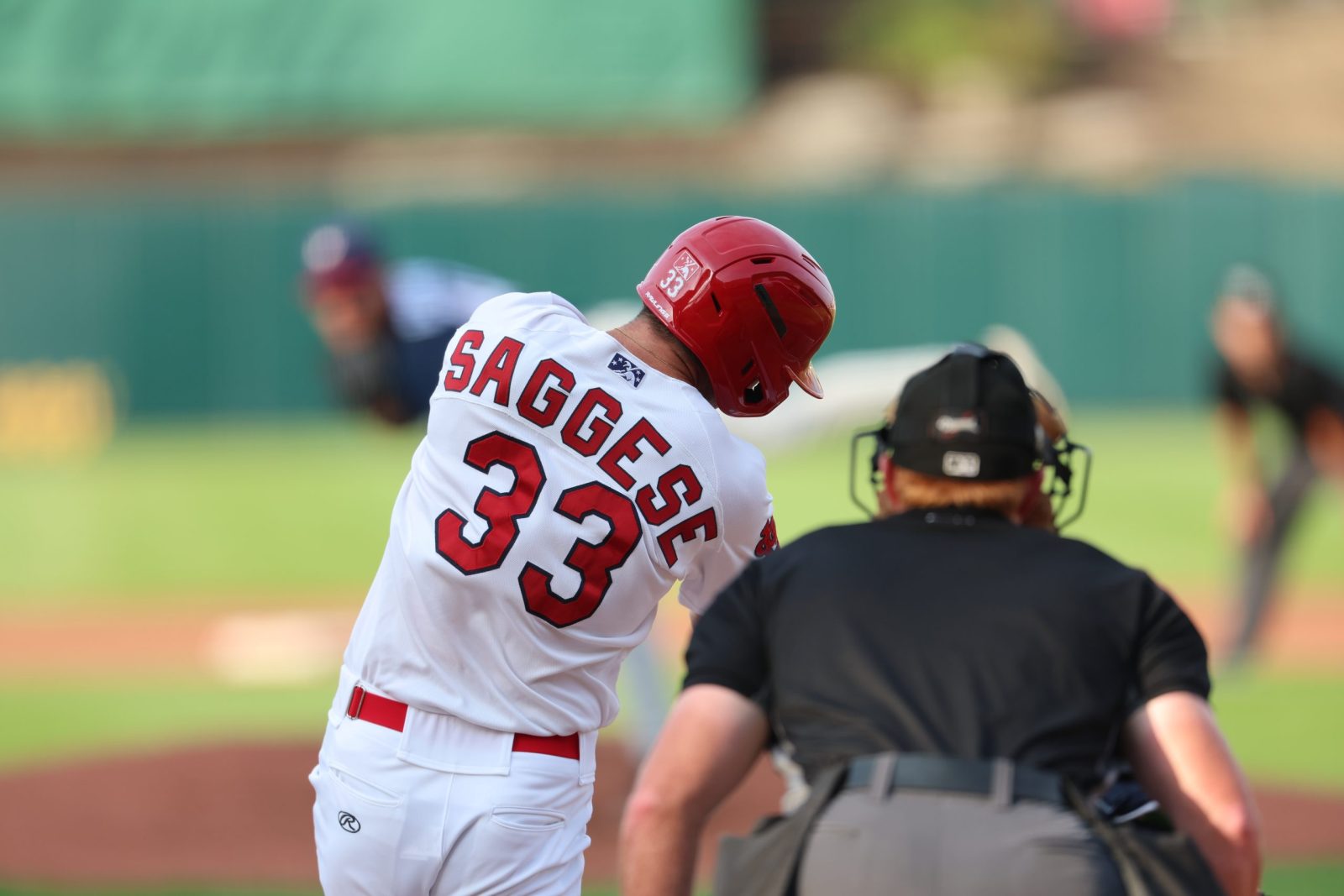 Thomas Saggese, wearing a Springfield Cardinals uniform, swings his bat during a game