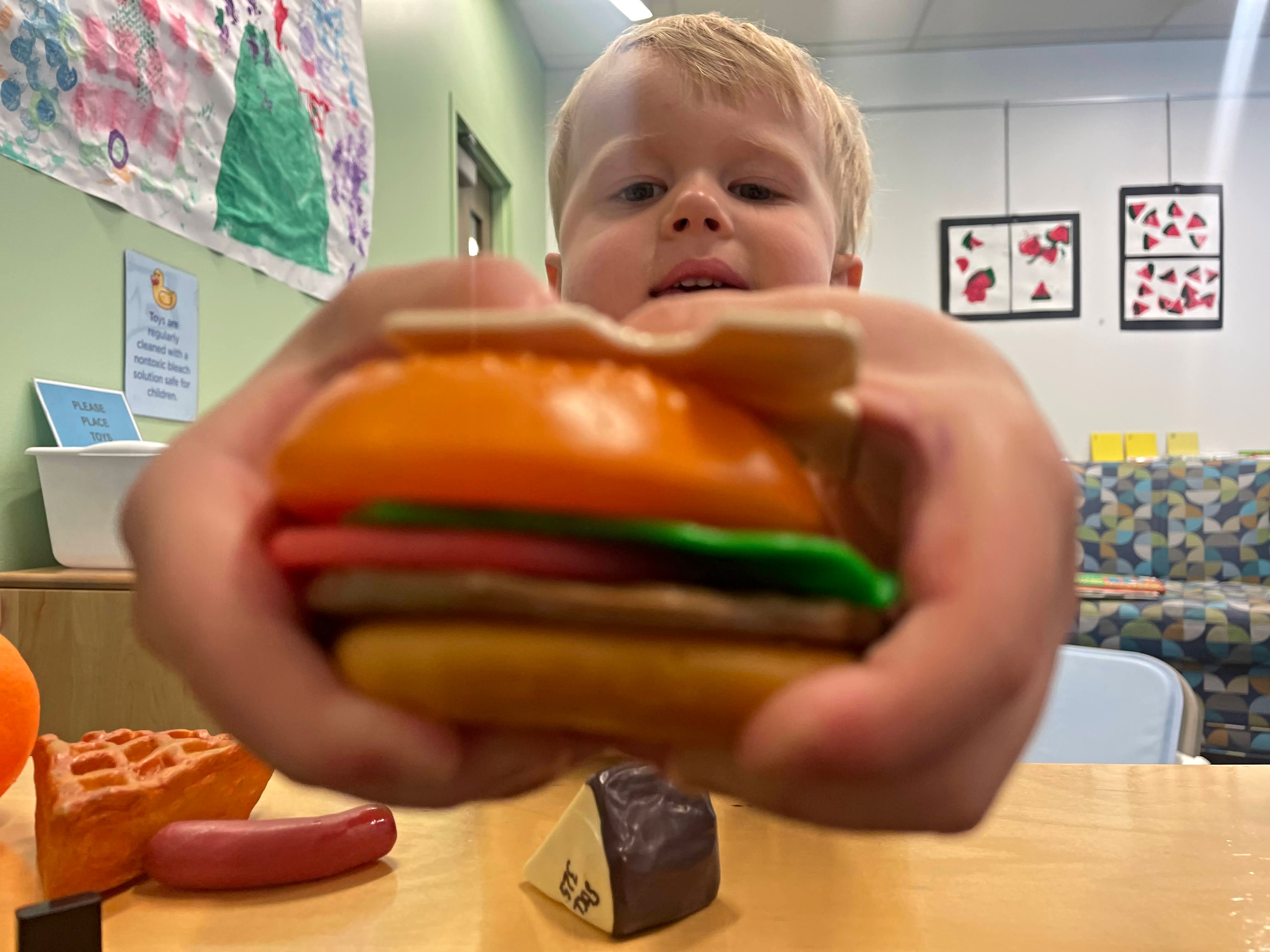Leo serves up a cheeseburger at the Schweitzer Brentwood Branch Library in Springfield.