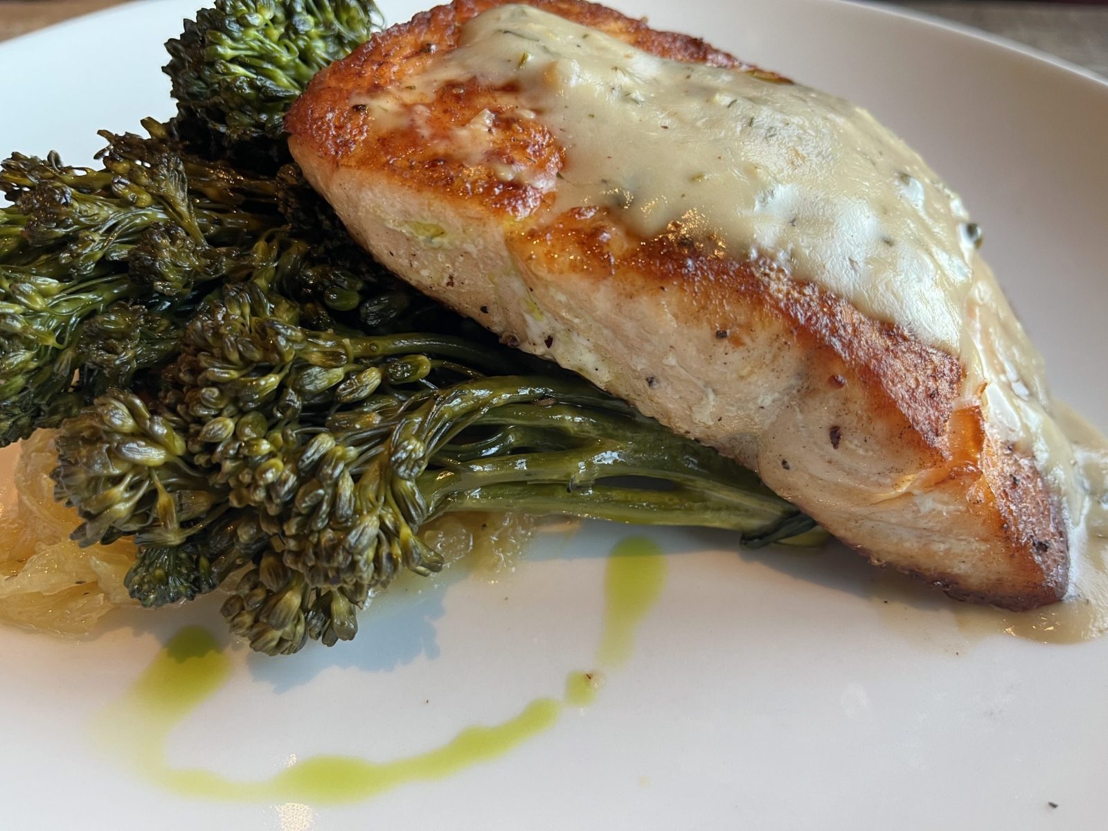 The roasted salmon with spaghetti squash, broccolini, lemon and caper sauce at Ozark Mill at Finley Farms