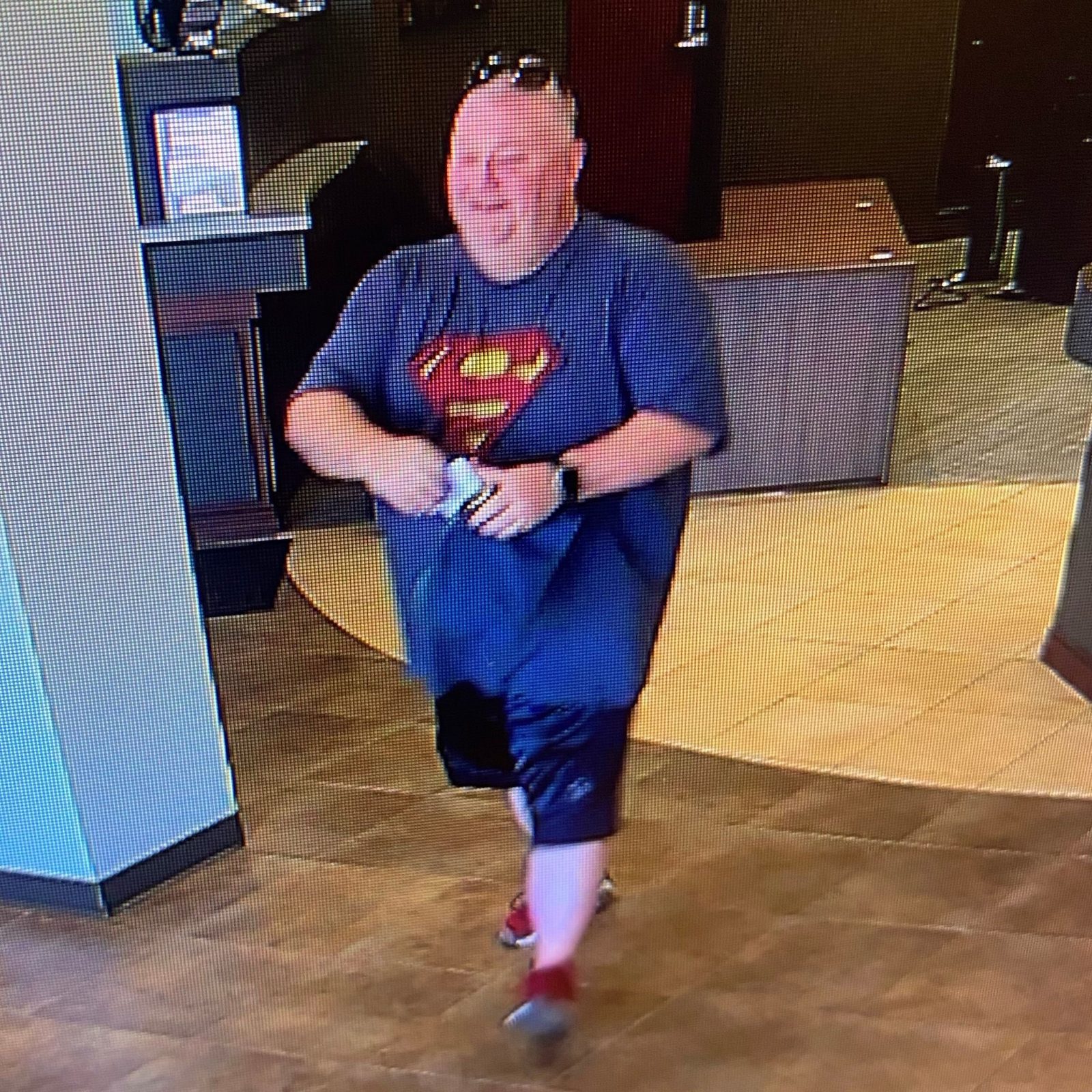 Man suspected of robbing Legacy Bank branch in Springfield Sept. 29. He is bald, between 5-foot-10 and 6 feet tall, and was wearing a blue T-shirt with the Superman logo.