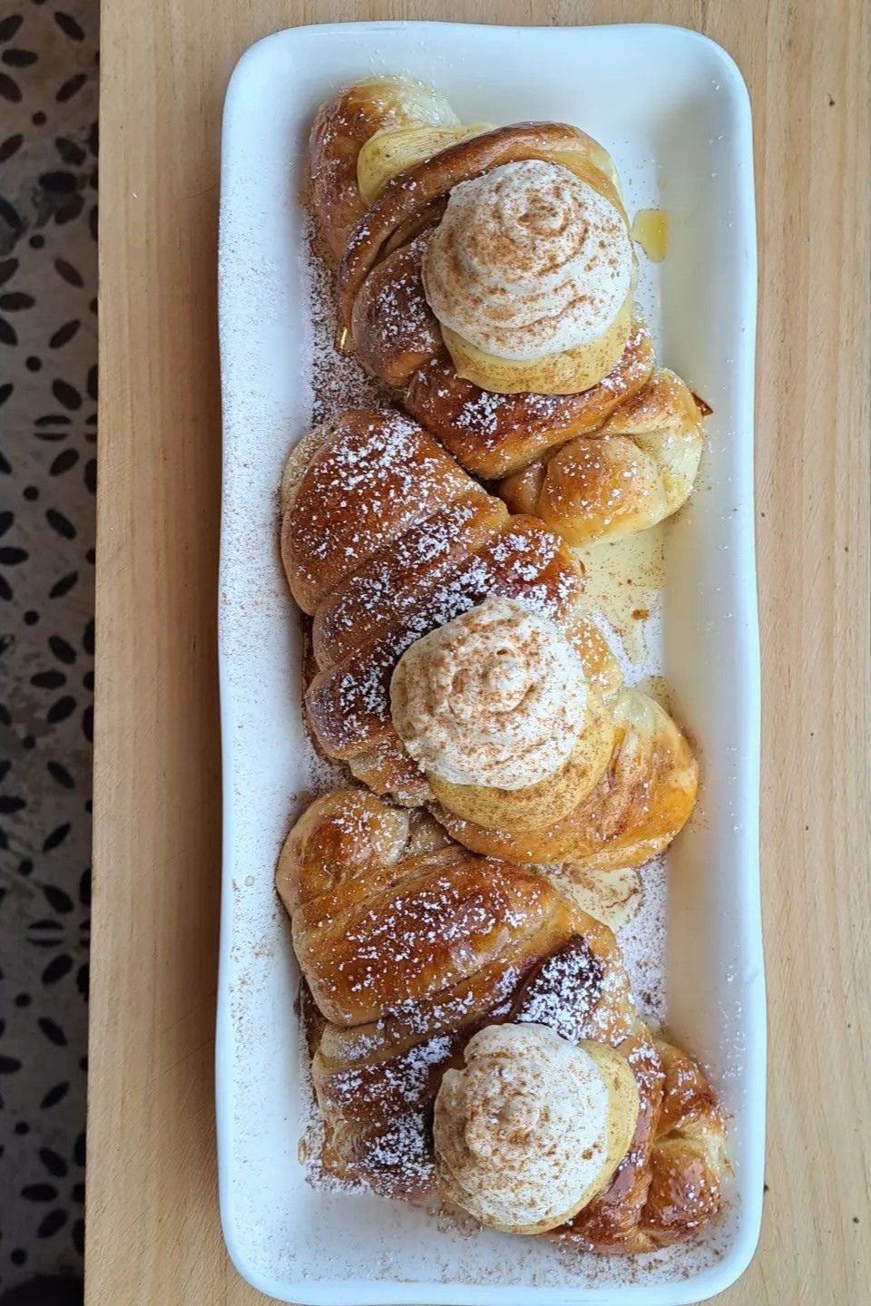 Pumpkin pie whipped ricotta croissant from Blue Heron Farm & Bakery sit on a white tray