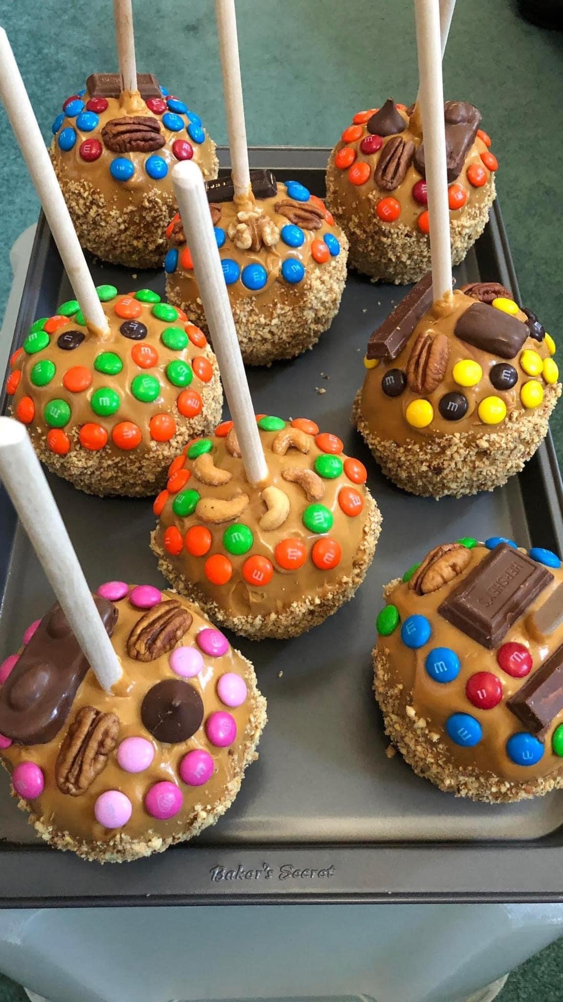 A tray of hand-dipped caramel apples.