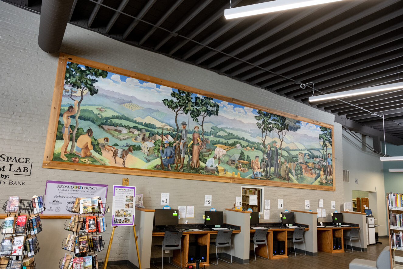 A mural hangs in a public library in Neosho, Missouri