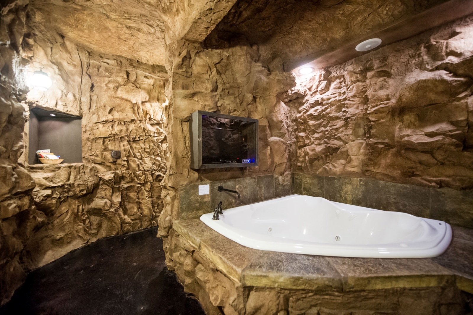 A hot tub inside a "hobbit cave" room at Eureka Springs Treehouses, Caves, Castles & Hobbits