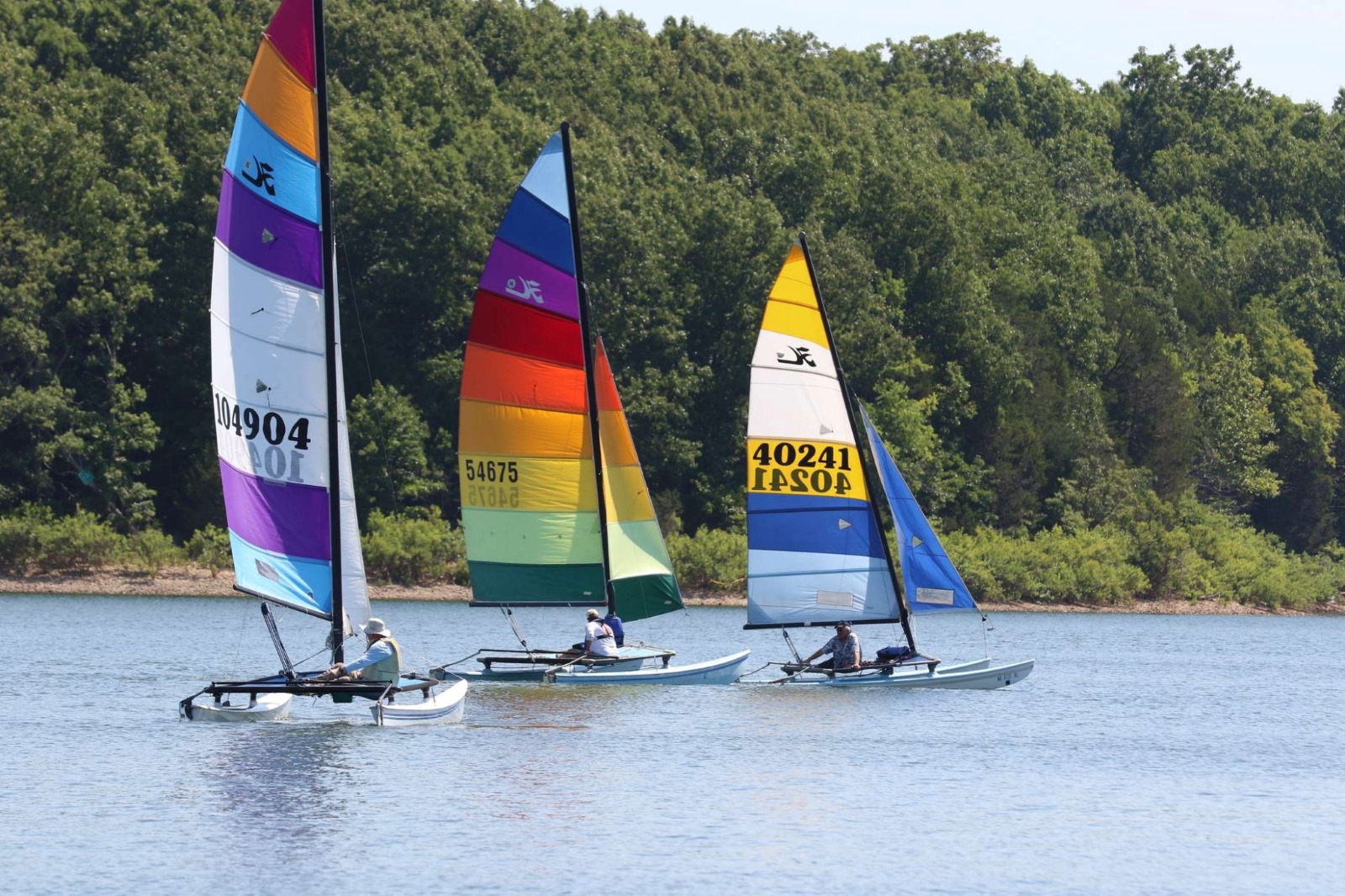 Three sailboats on Fellows Lake in Springfield, Missouri