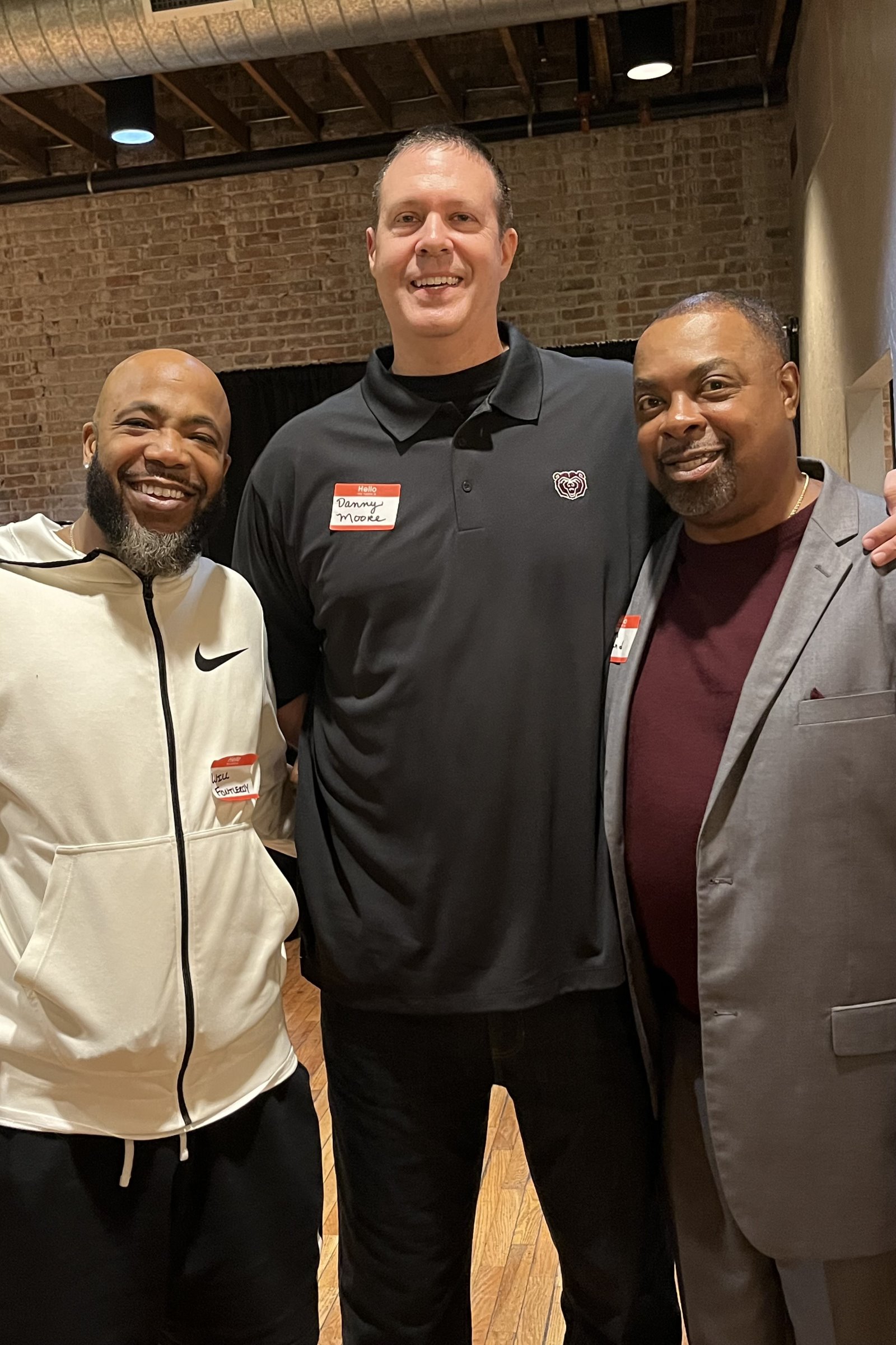 Danny Moore, middle, poses for a photo with former Missouri State teammate William Fontleroy, left, and Bears great Winston Garland