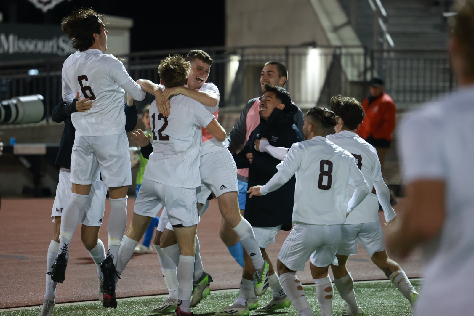 The Missouri State Bears soccer team celebrates after scoring a goal