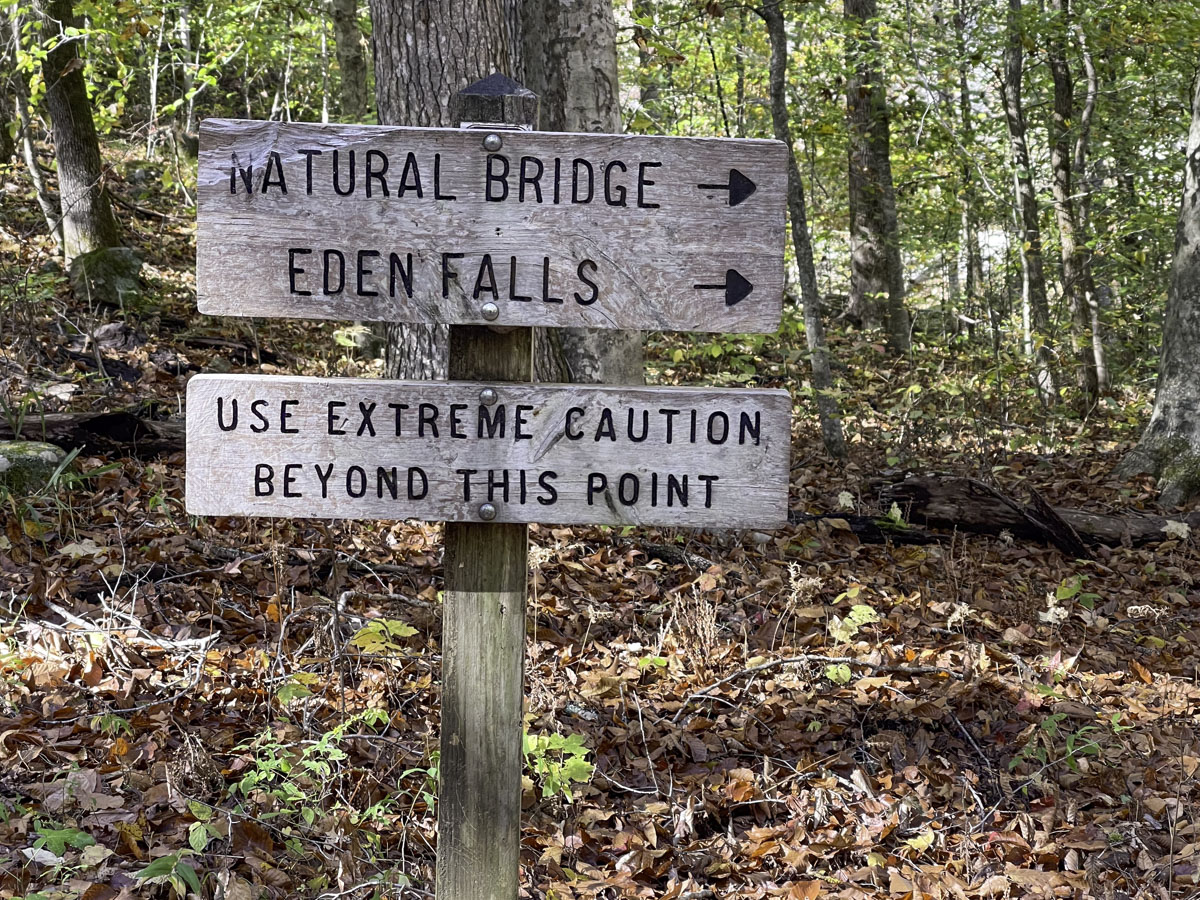 At the end of the 1-mile easy section of trail in Lost Valley, this sign points hikers toward amazing rock formations, a natural bridge and Eden Falls. 
