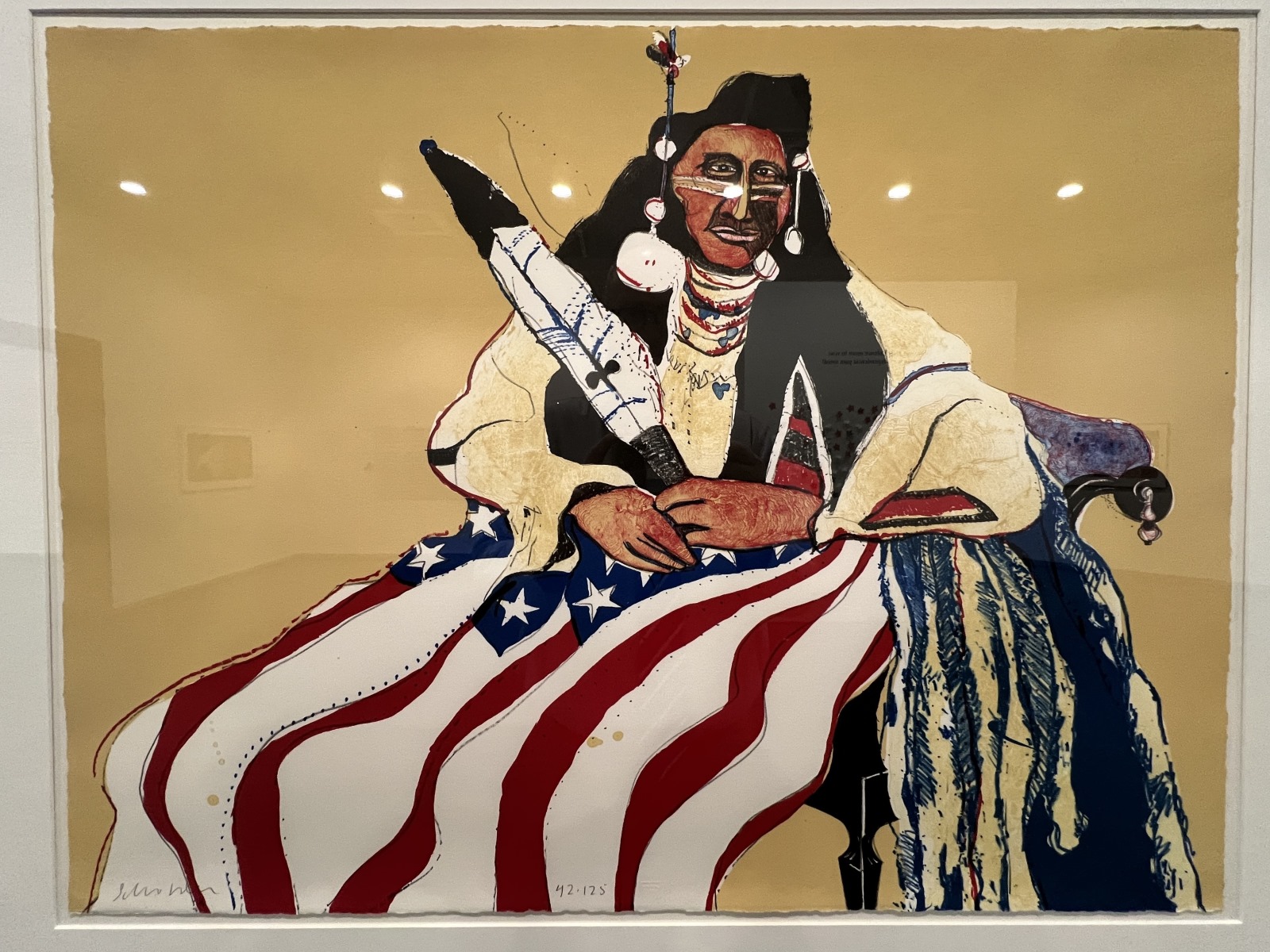 A painting of a Native American with a United States flag on their lap