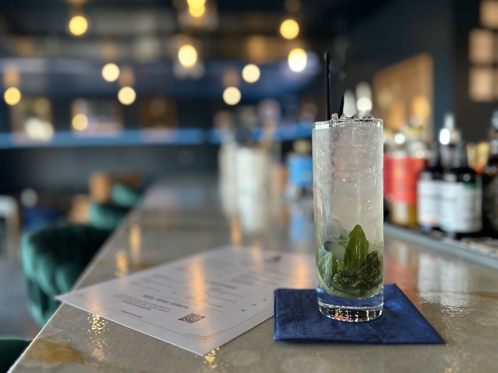 A Basil Smash cocktail sits on the bar at Miss Boston's Cocktail Lounge in Republic.