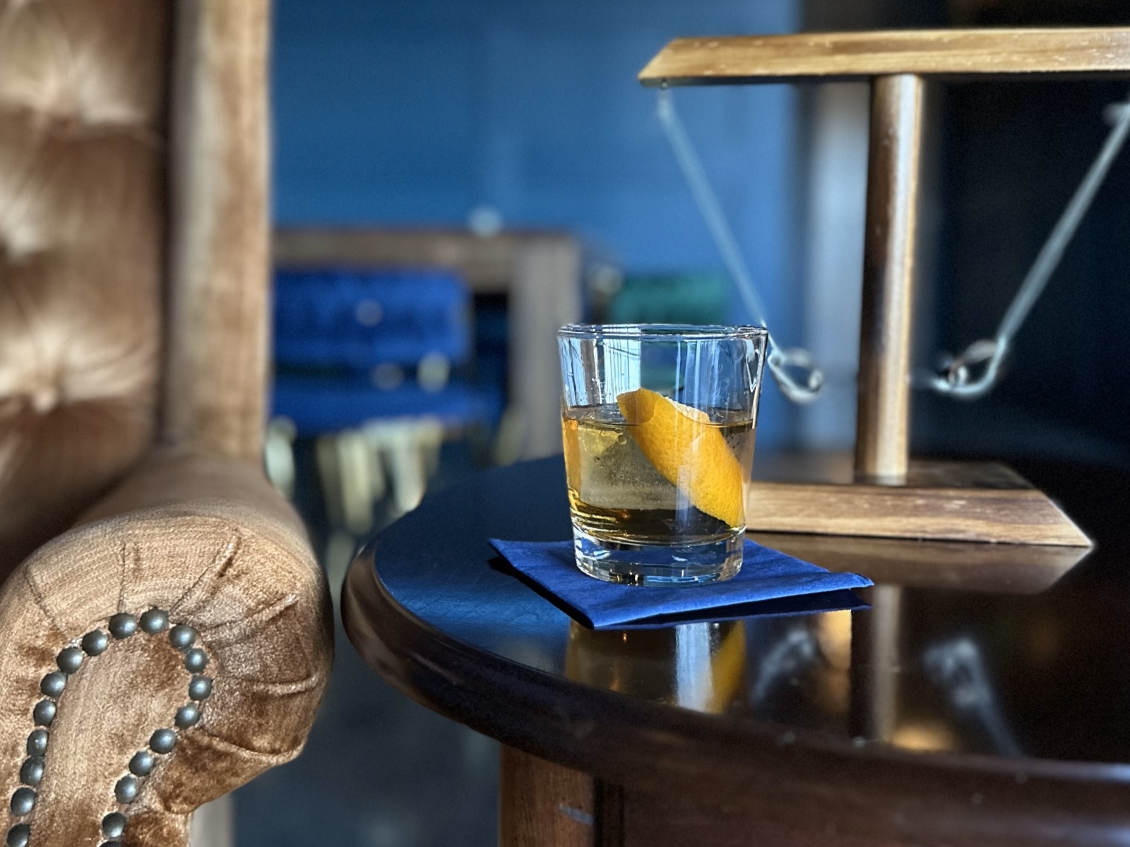 An Old-Fashioned cocktail sits on a table inside Miss Boston's Cocktail Lounge in Republic