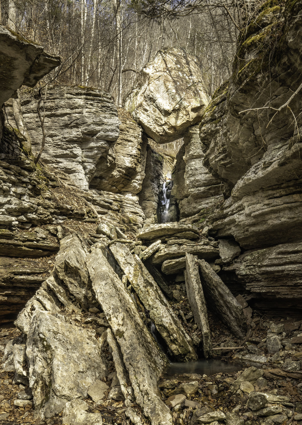 You’ll know it when you see it: A waterfall flows beneath Balanced Rock, an enormous boulder perched on the edge of a gorge bluff high above Leatherwood Creek. (Photo by Sony Hocklander)
