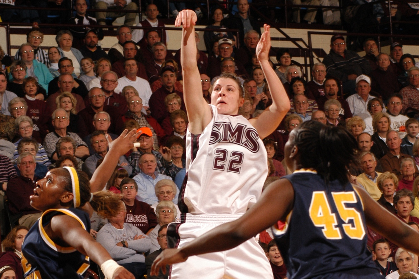 Kari Koch-Dowell, wearing an SMS Lady Bears uniform, shoots the basketball during a game.