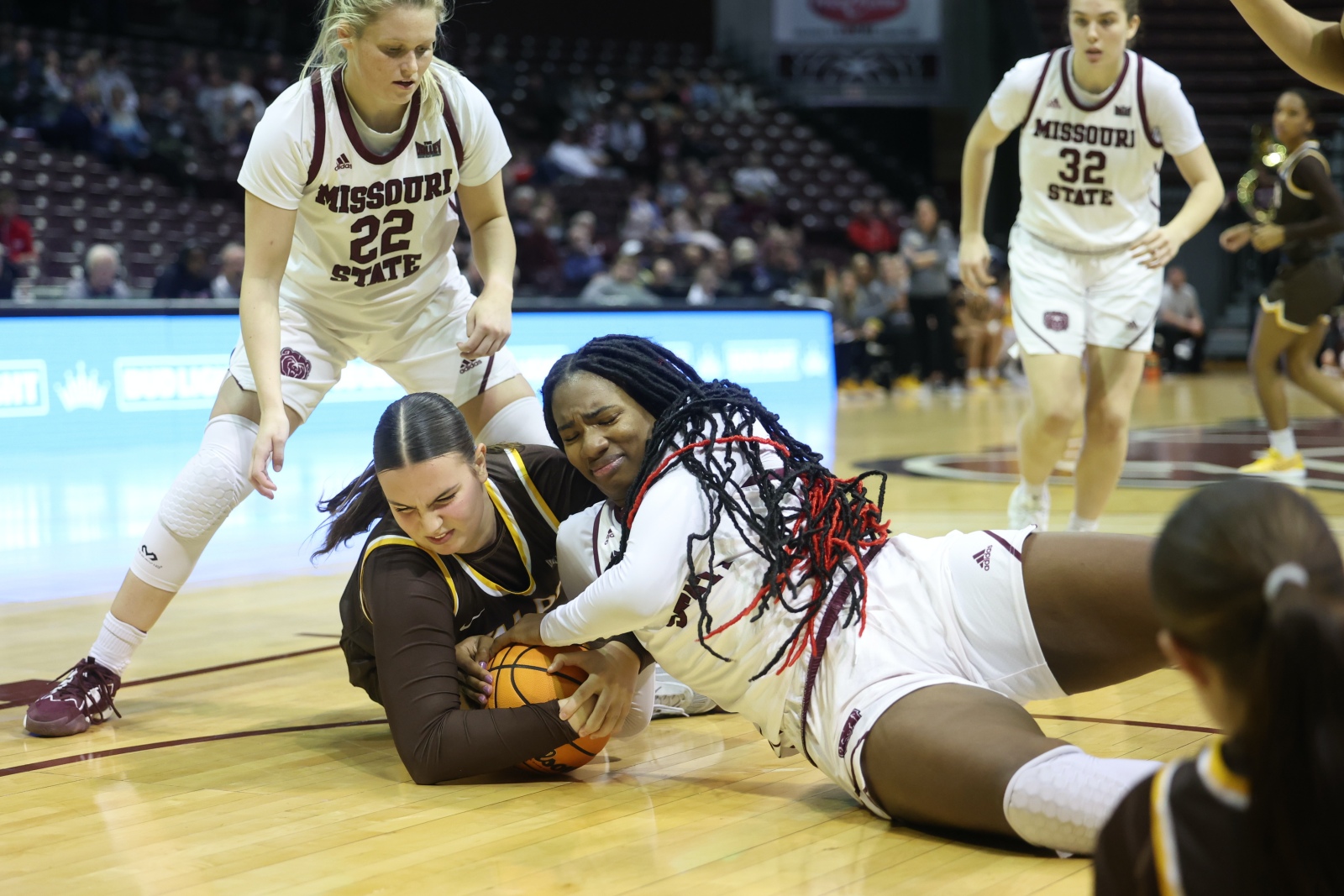 Missouri State’s Kennedy Taylor dives to the floor to battle for a loose ball during the Lady Bears’ 67-47 victory on Thursday night.