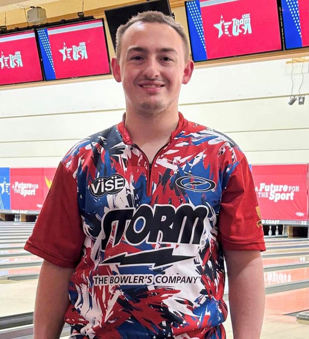 Bowler Spencer Robarge stands next to bowling lanes