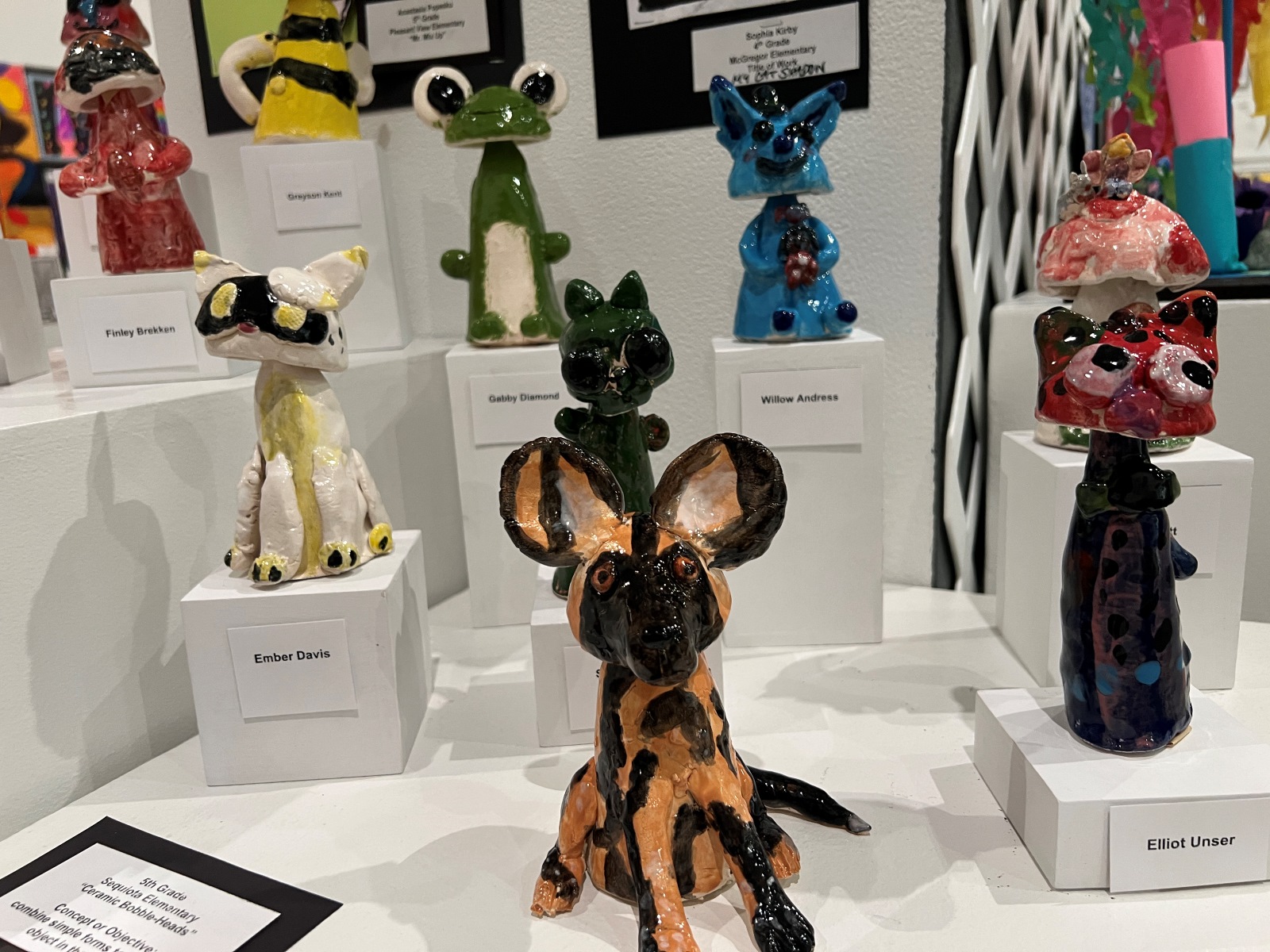 Ceramic bobbleheads on display at the Springfield Art Museum for the 92nd annual All School Exhibition