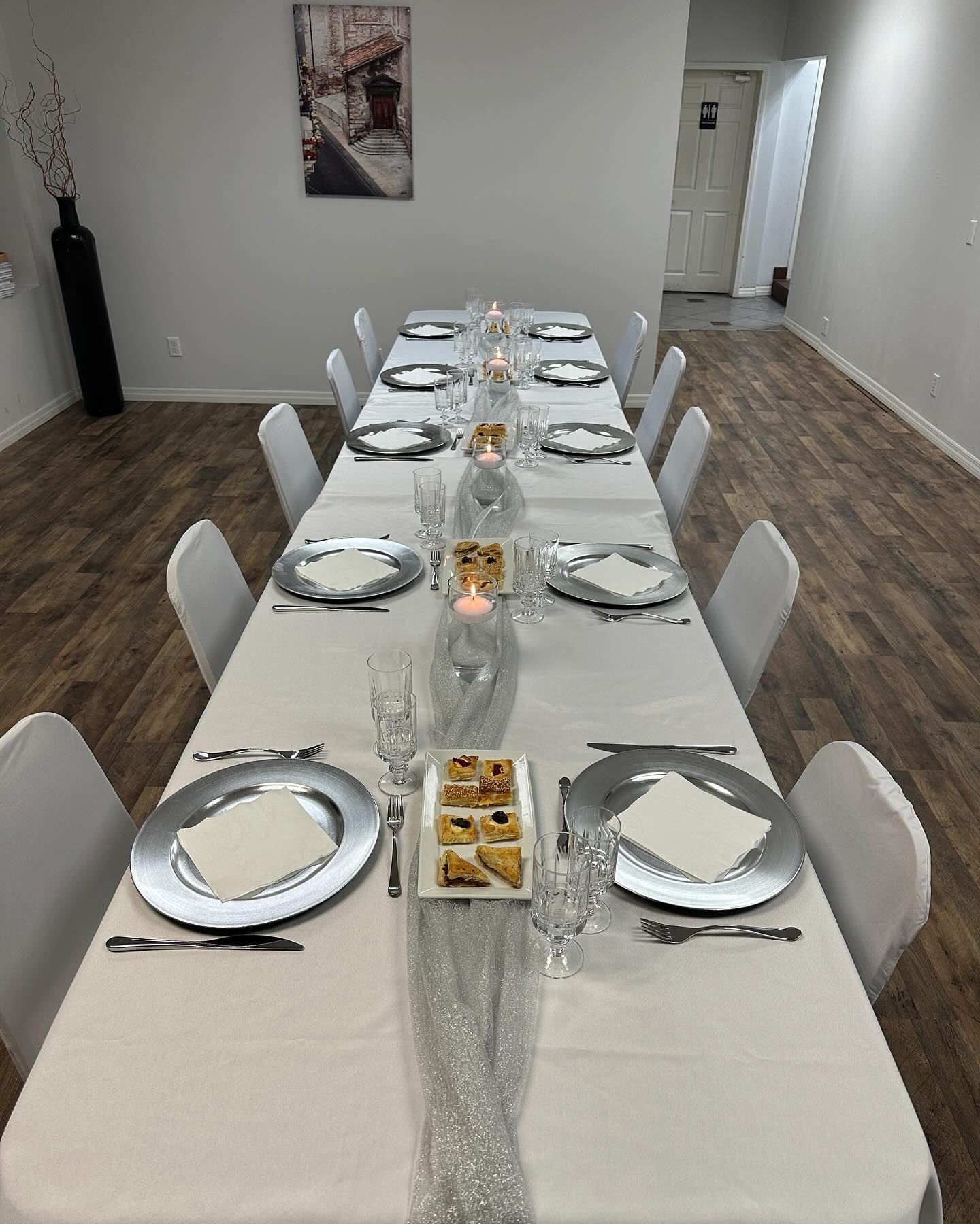 A long table set with dishes and candles for a date night cooking class at Italian Kitchen in Springfield, Missouri.